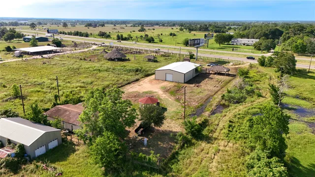 a front view of house with outdoor seating and green space