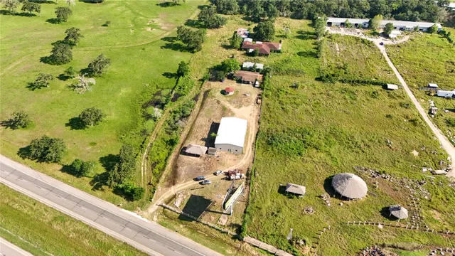 an aerial view of residential house with an outdoor space