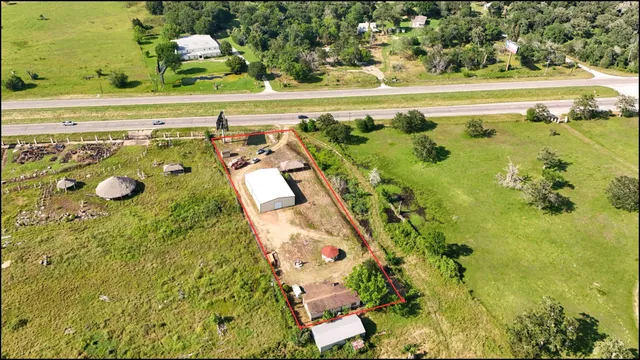 a view of a swimming pool with a yard