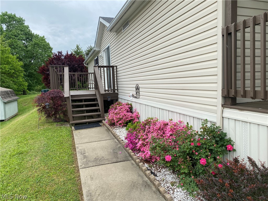 14980 Sprucevale Road East Liverpool, OH 43920 - Photo 4 of 19 View of home's exterior featuring a deck and a lawn