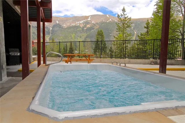 a view of a swimming pool with a lounge chair