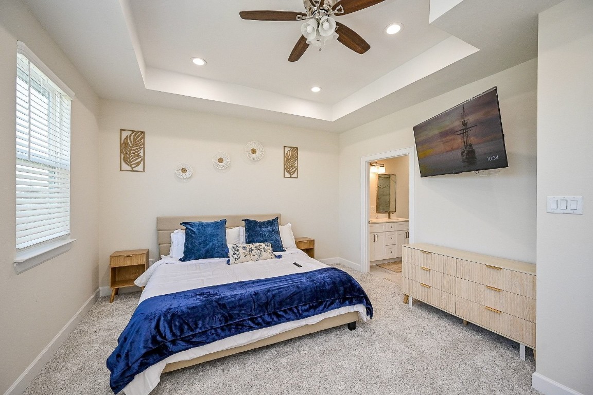 4746 Mallow Street Houston, TX 77033 - Photo 11 of 38 a bedroom with a large bed and a window