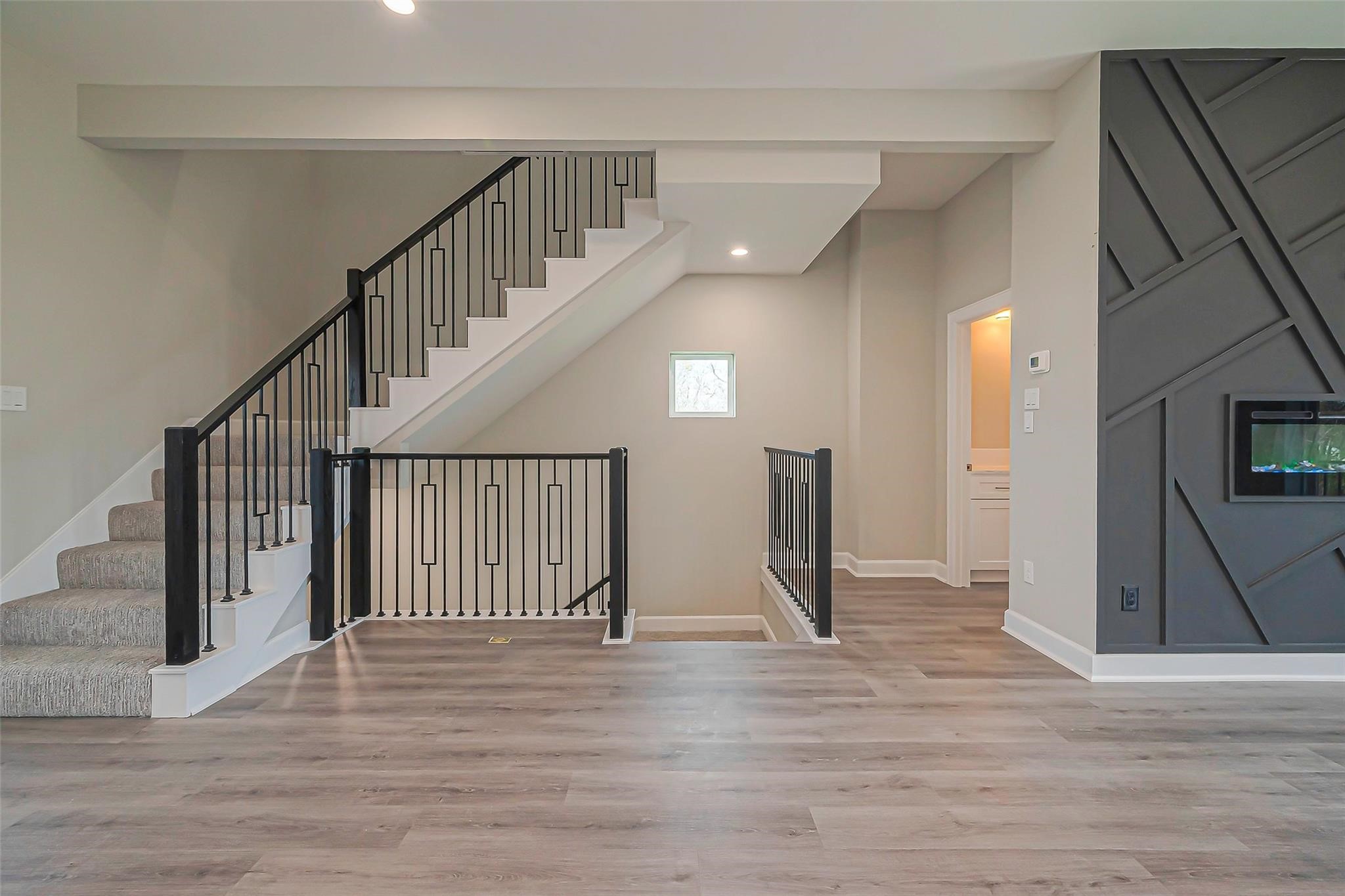 4746 Mallow Street Houston, TX 77033 - Photo 22 of 38 Unit 2: Living room with luxury vinyl flooring.