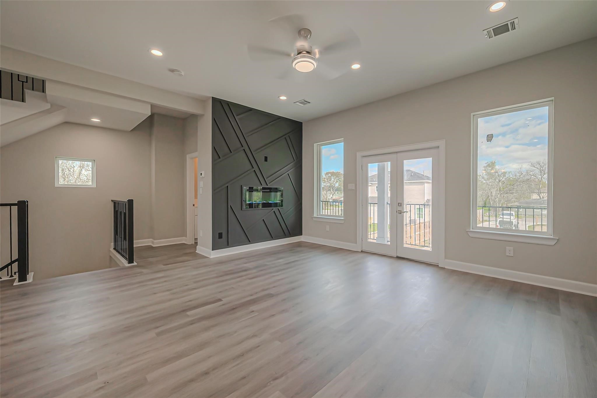 4746 Mallow Street Houston, TX 77033 - Photo 23 of 38 Unit 2: Bright living room with double doors to front facing balcony.