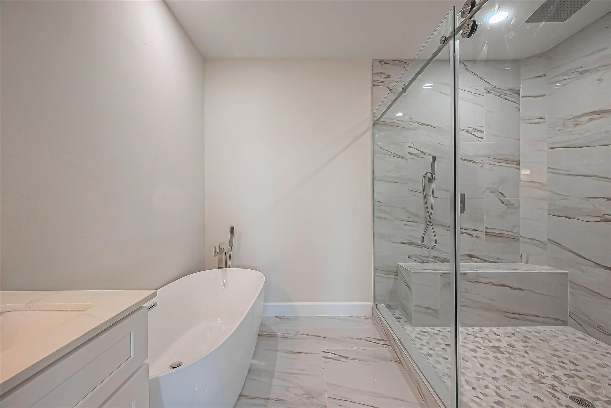 4746 Mallow Street Houston, TX 77033 - Photo 32 of 38 Unit 2: Primary ensuite with double vanity, huge walk in showere with double shower heads and soaking tub.