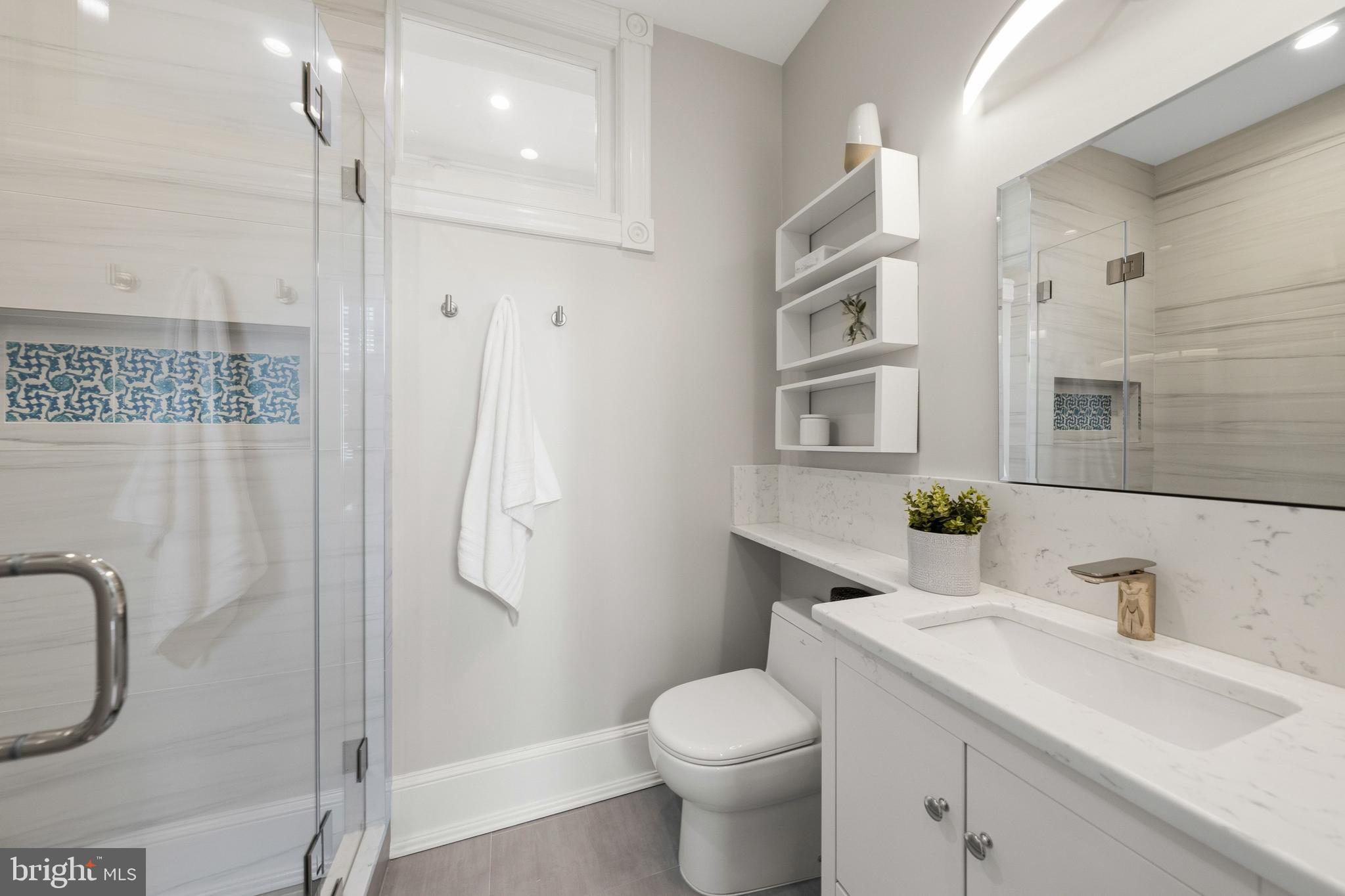 3420 P Street Northwest Washington, DC 20007 - Photo 15 of 32 a bathroom with a granite countertop sink toilet and shower