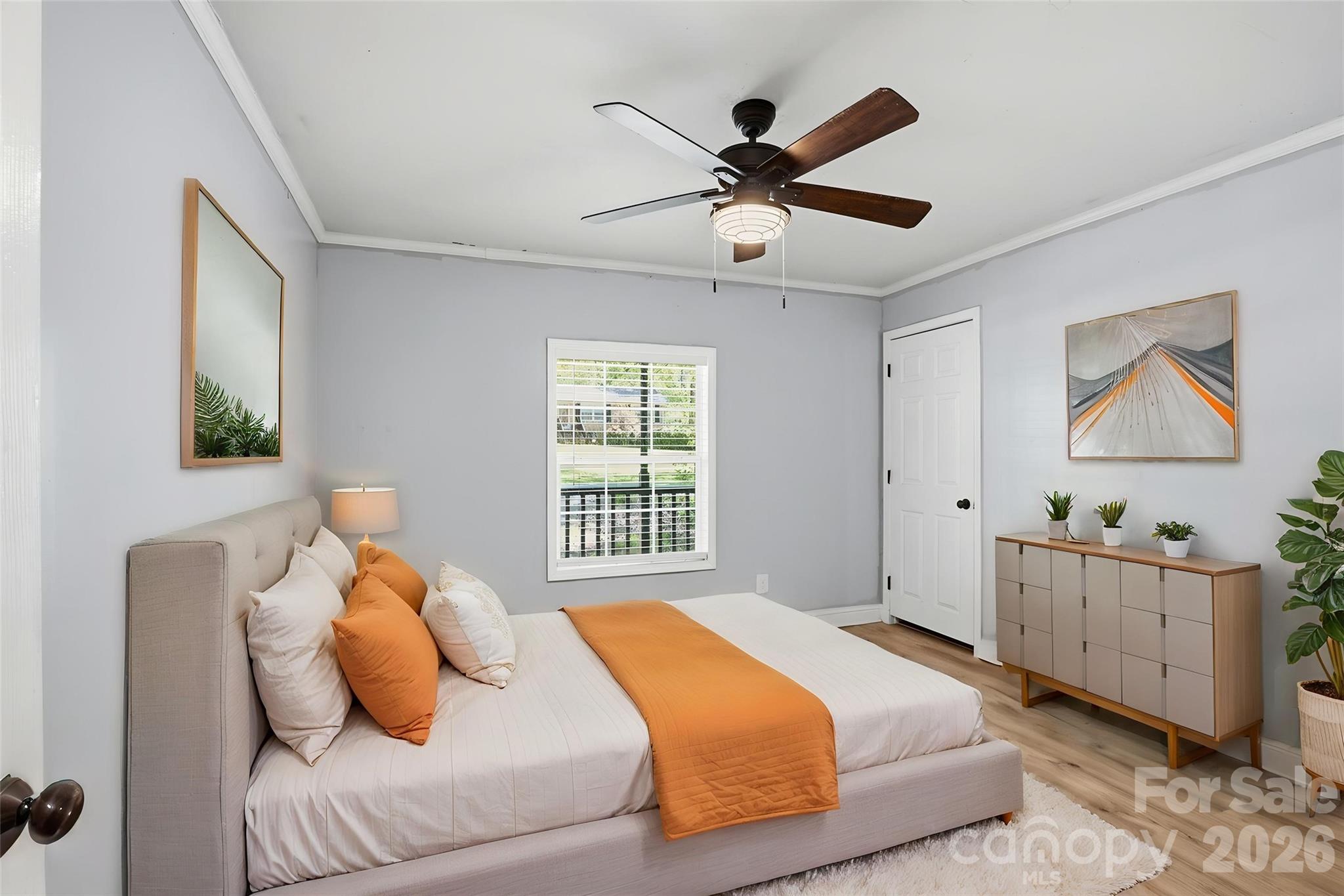 116 Springdale Drive York, SC 29745 - Photo 21 of 32 a bedroom with a bed and a chandelier