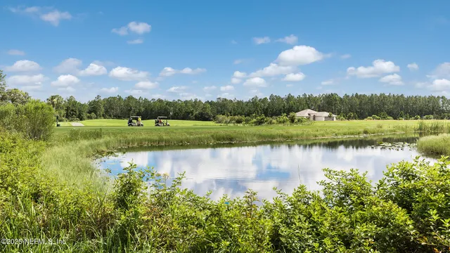 a view of a lake with trees by side of it