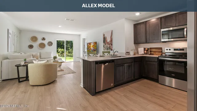 a kitchen with a sink and stainless steel appliances