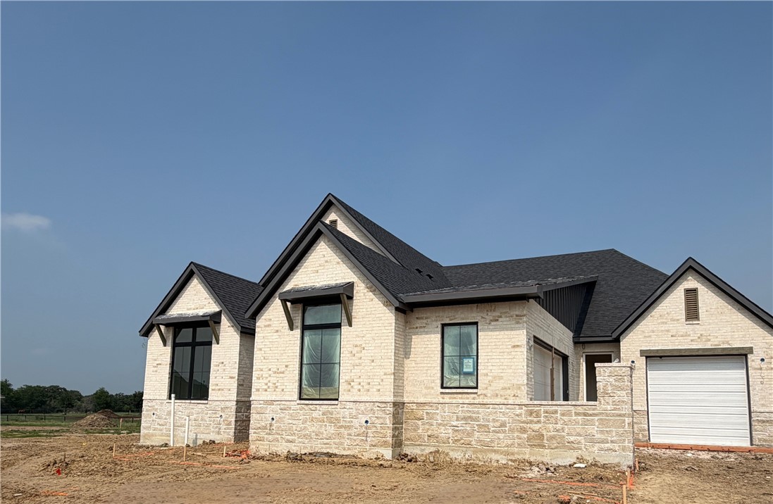 7032 Skipping Rock Path Bryan, TX 77808 - Photo 1 of 15 a front view of a house