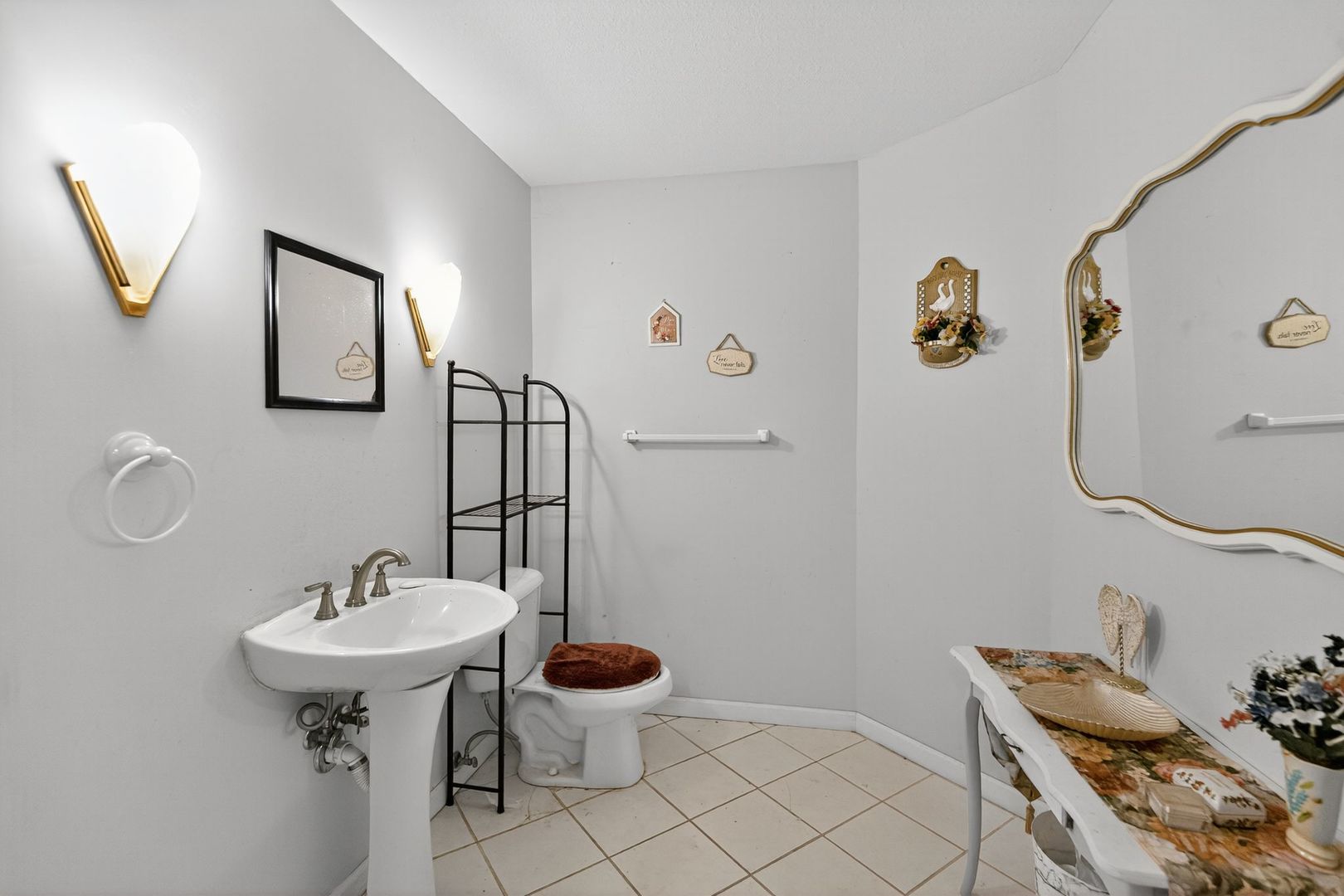 302 Jay Street Savoy, IL 61874 - Photo 11 of 16 a bathroom with a sink and mirror