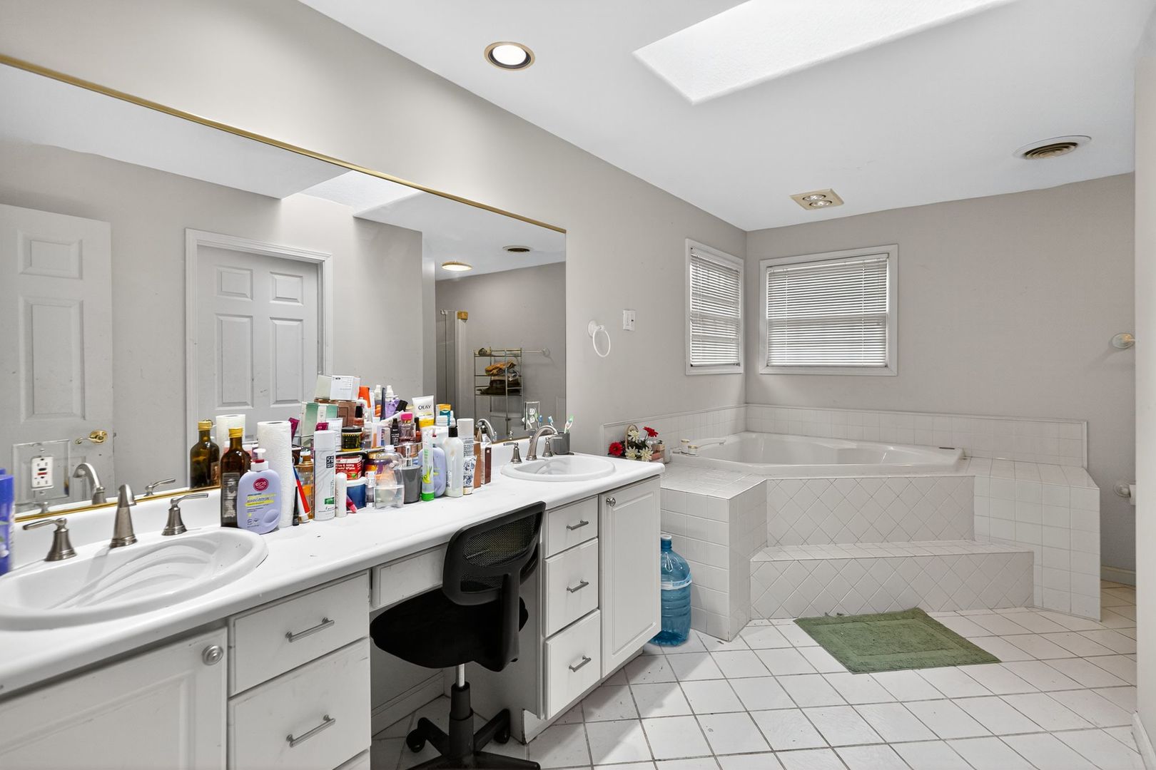 302 Jay Street Savoy, IL 61874 - Photo 13 of 16 a spacious bathroom with a double vanity sink mirror and bathtub