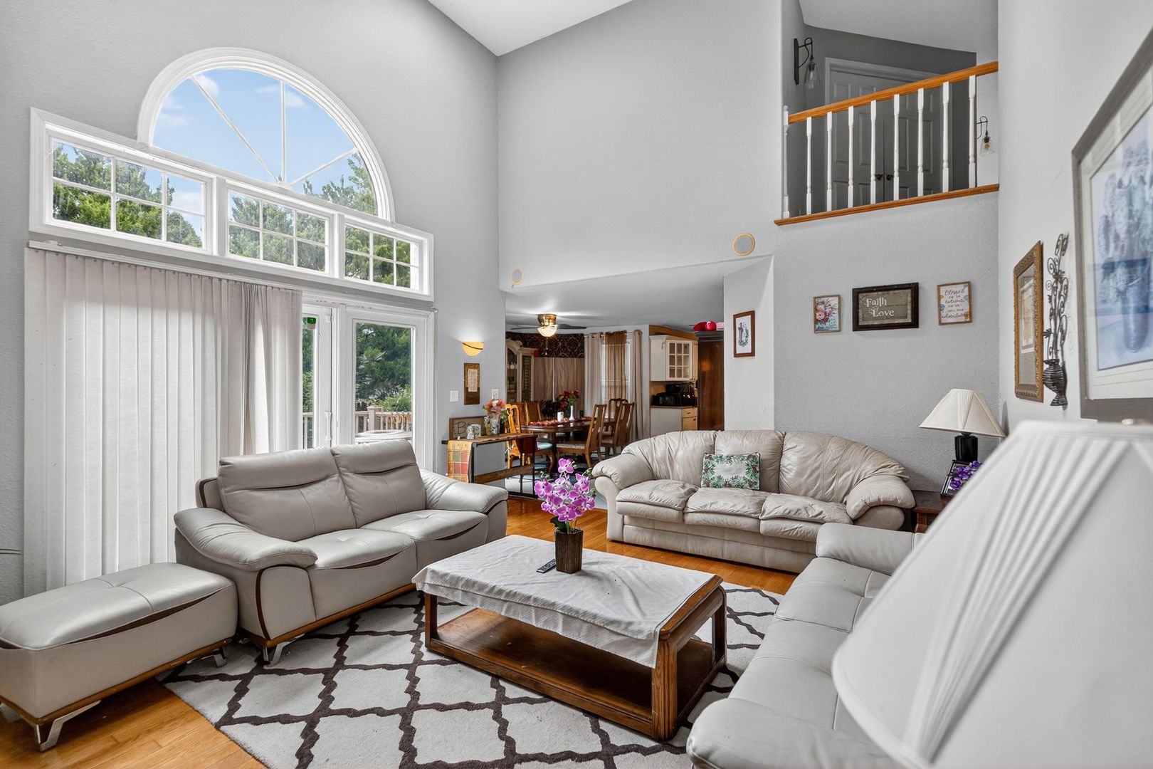 302 Jay Street Savoy, IL 61874 - Photo 8 of 16 a living room with furniture fireplace and a large window