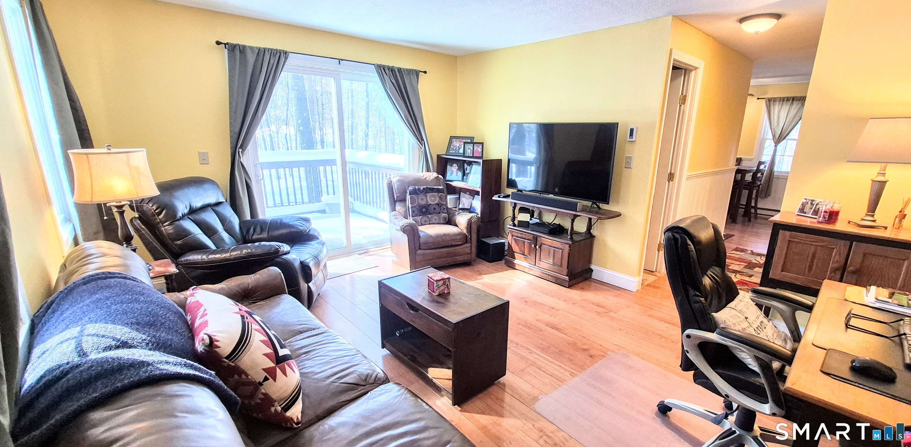 239 Old Farms Road, Unit 15C Avon, CT 06001 - Photo 13 of 29 a living room with furniture and a flat screen tv