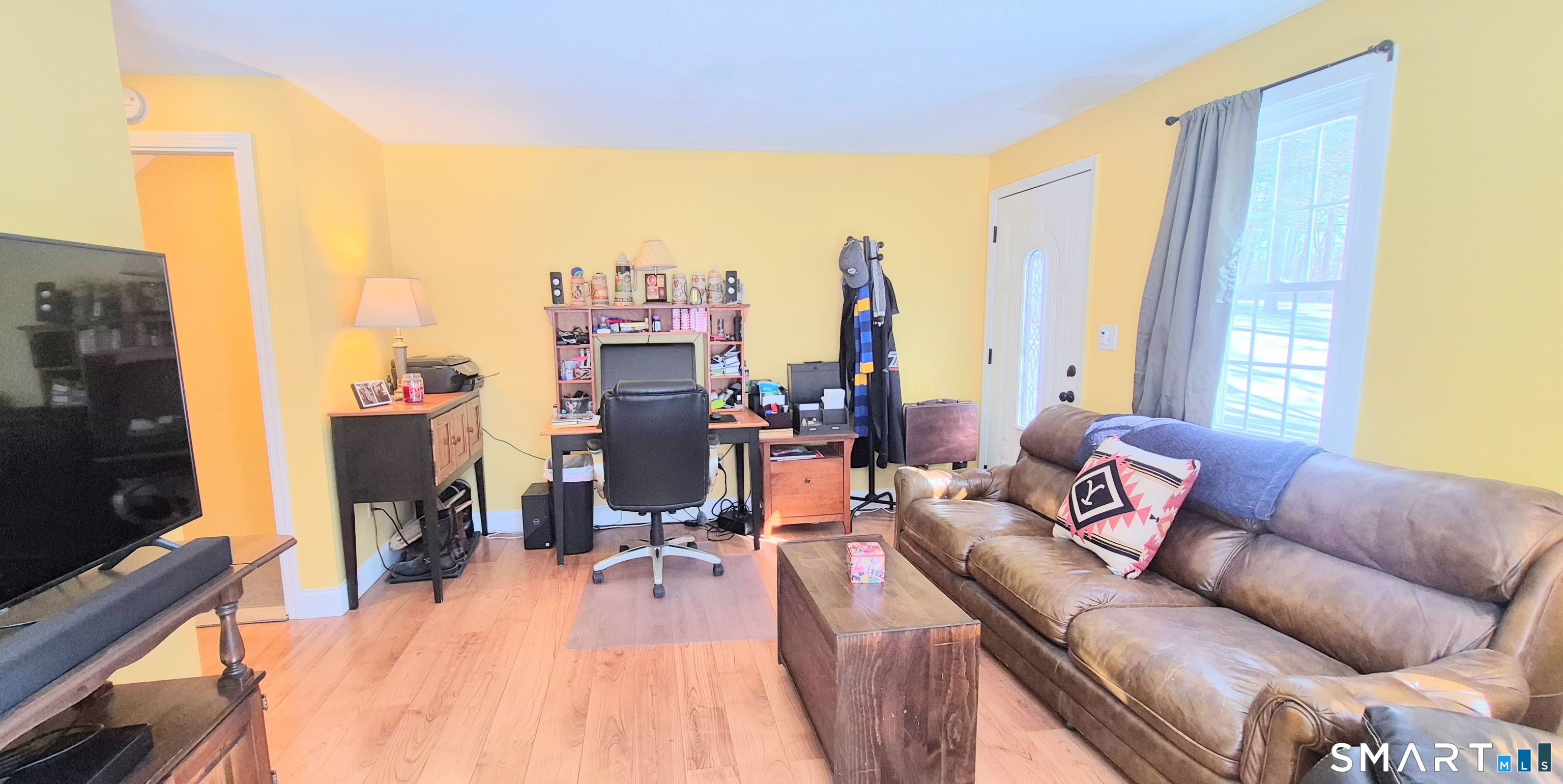 239 Old Farms Road, Unit 15C Avon, CT 06001 - Photo 14 of 29 a living room with furniture and a flat screen tv