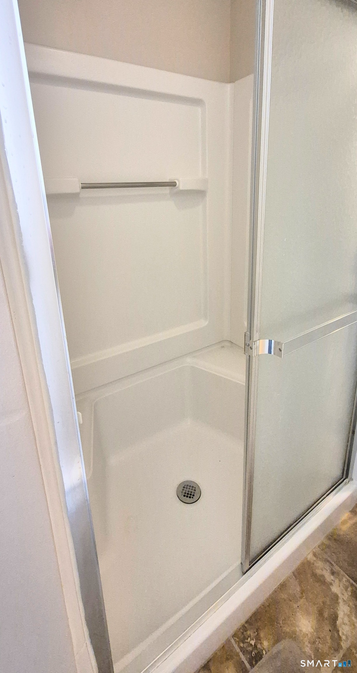 239 Old Farms Road, Unit 15C Avon, CT 06001 - Photo 17 of 29 a bathroom with a glass shower door