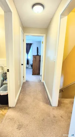 a bedroom with a bed and a lamp