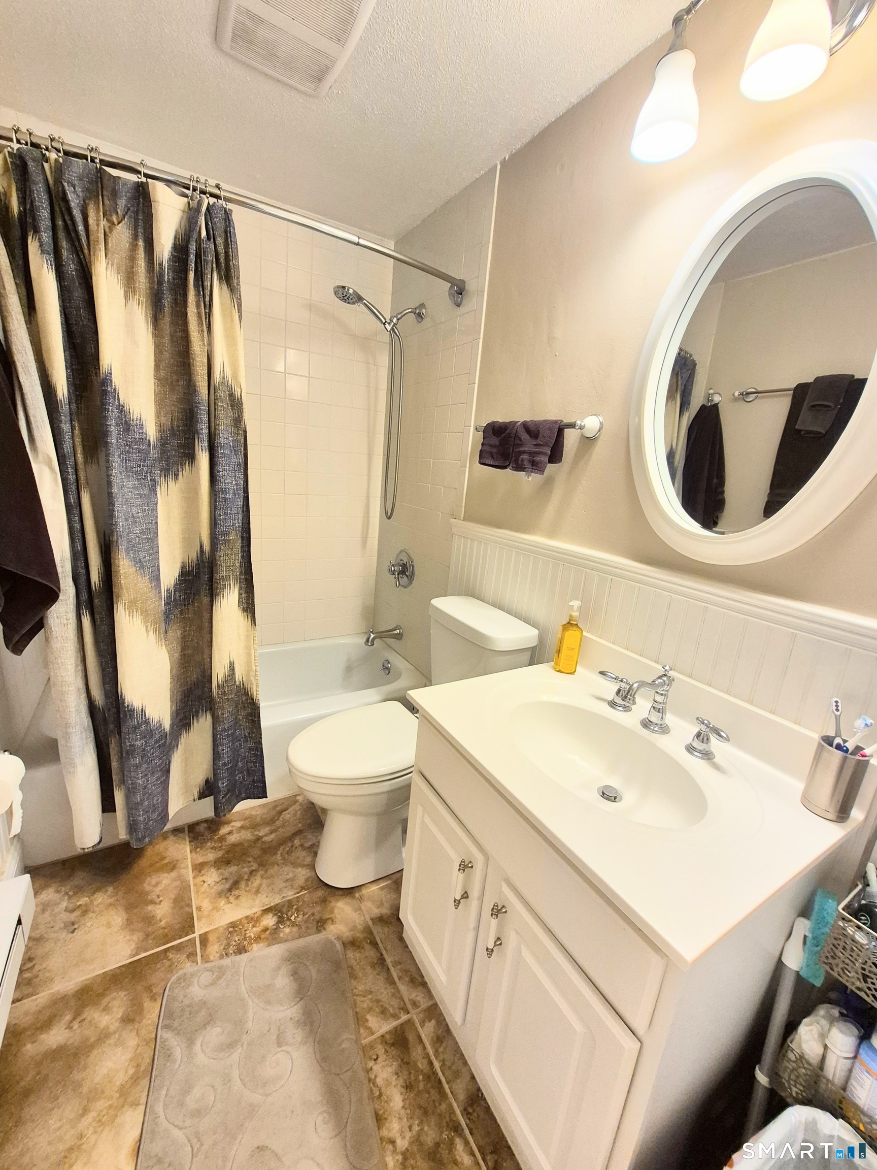 239 Old Farms Road, Unit 15C Avon, CT 06001 - Photo 23 of 29 a bathroom with a sink toilet and shower