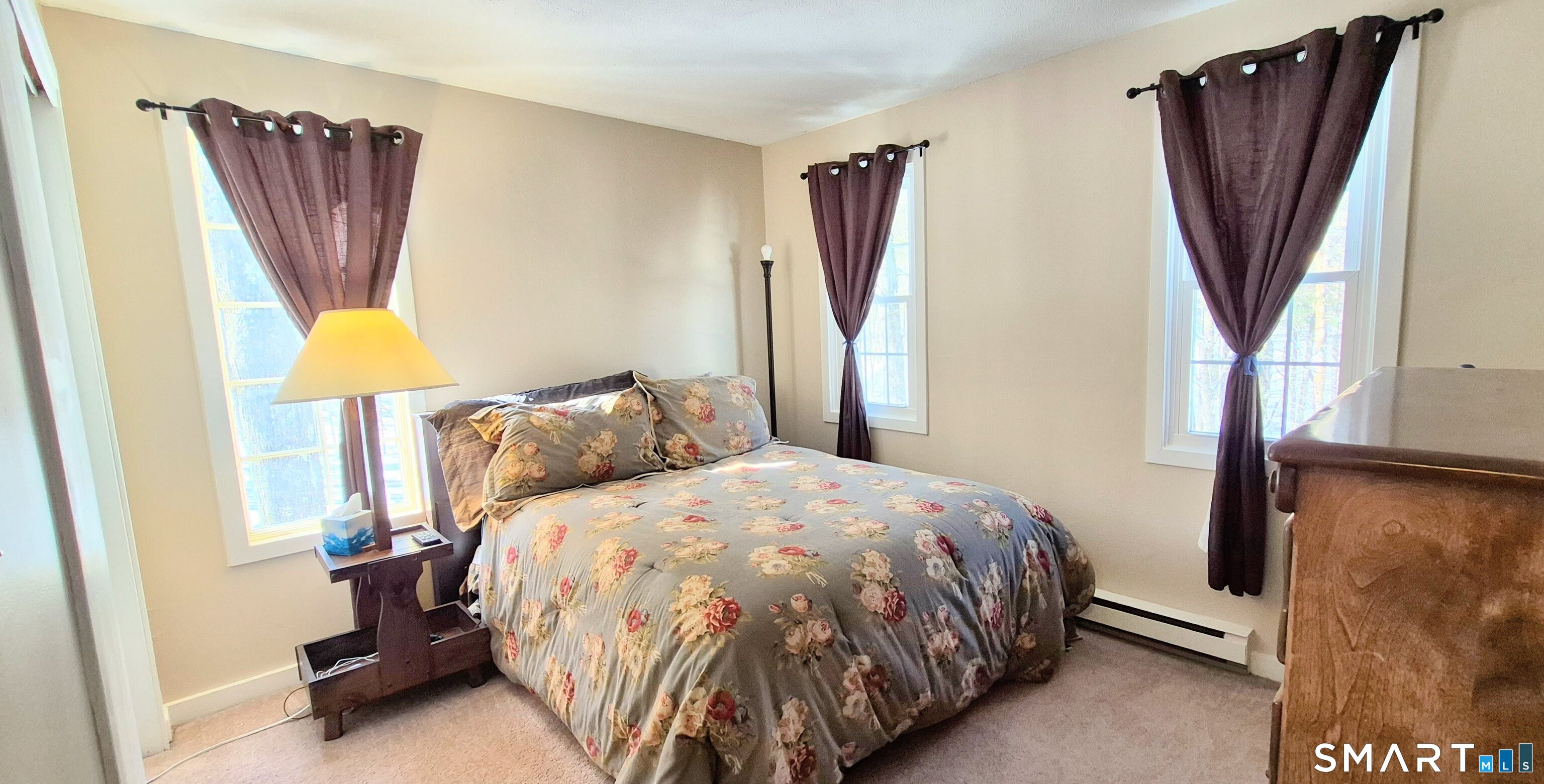 239 Old Farms Road, Unit 15C Avon, CT 06001 - Photo 24 of 29 a bed sitting in a bedroom next to a window