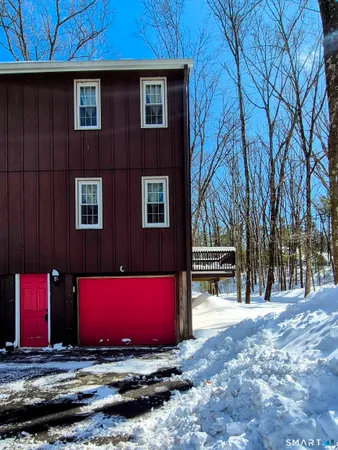 a very nice looking room with a large window a dining table and chairs