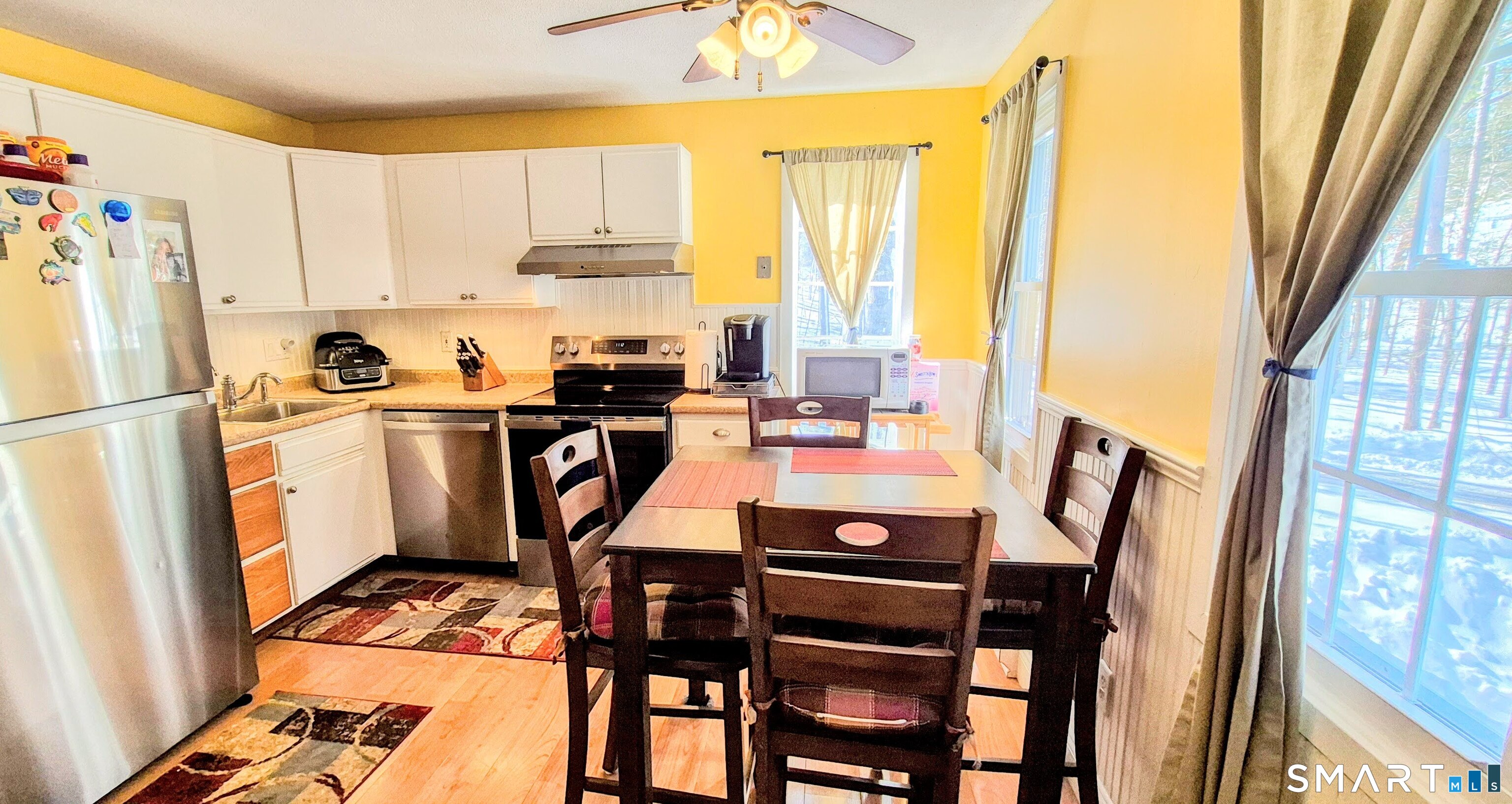 239 Old Farms Road, Unit 15C Avon, CT 06001 - Photo 7 of 29 a view of a dining room with furniture window and outside view
