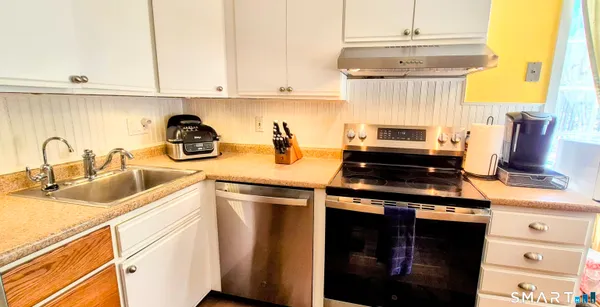 a bed room with a bed and a television