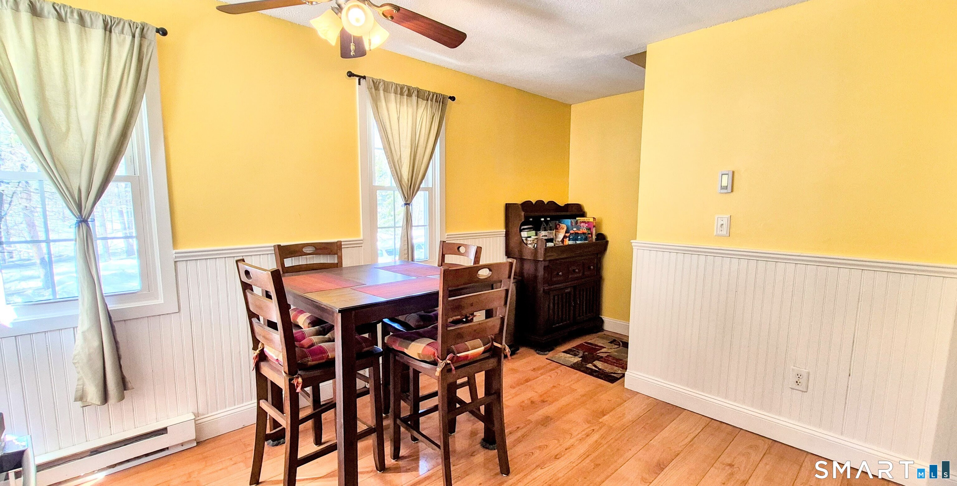 239 Old Farms Road, Unit 15C Avon, CT 06001 - Photo 9 of 29 a view of a dining table and chairs in the balcony