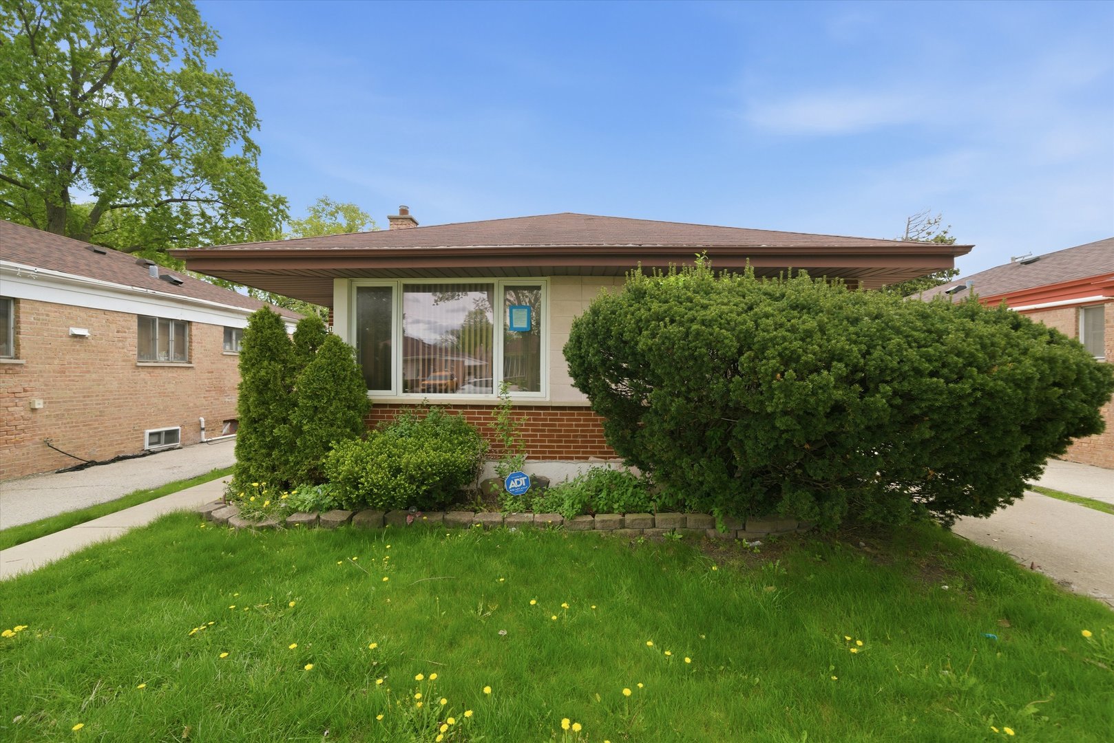 119 Rice Avenue Bellwood, IL 60104 - Photo 21 of 25 a front view of a house with a yard