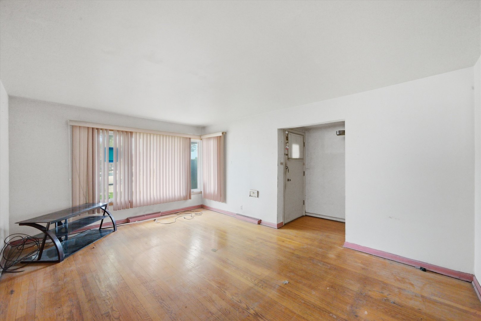 119 Rice Avenue Bellwood, IL 60104 - Photo 3 of 25 a view of an empty room with window and a bedroom