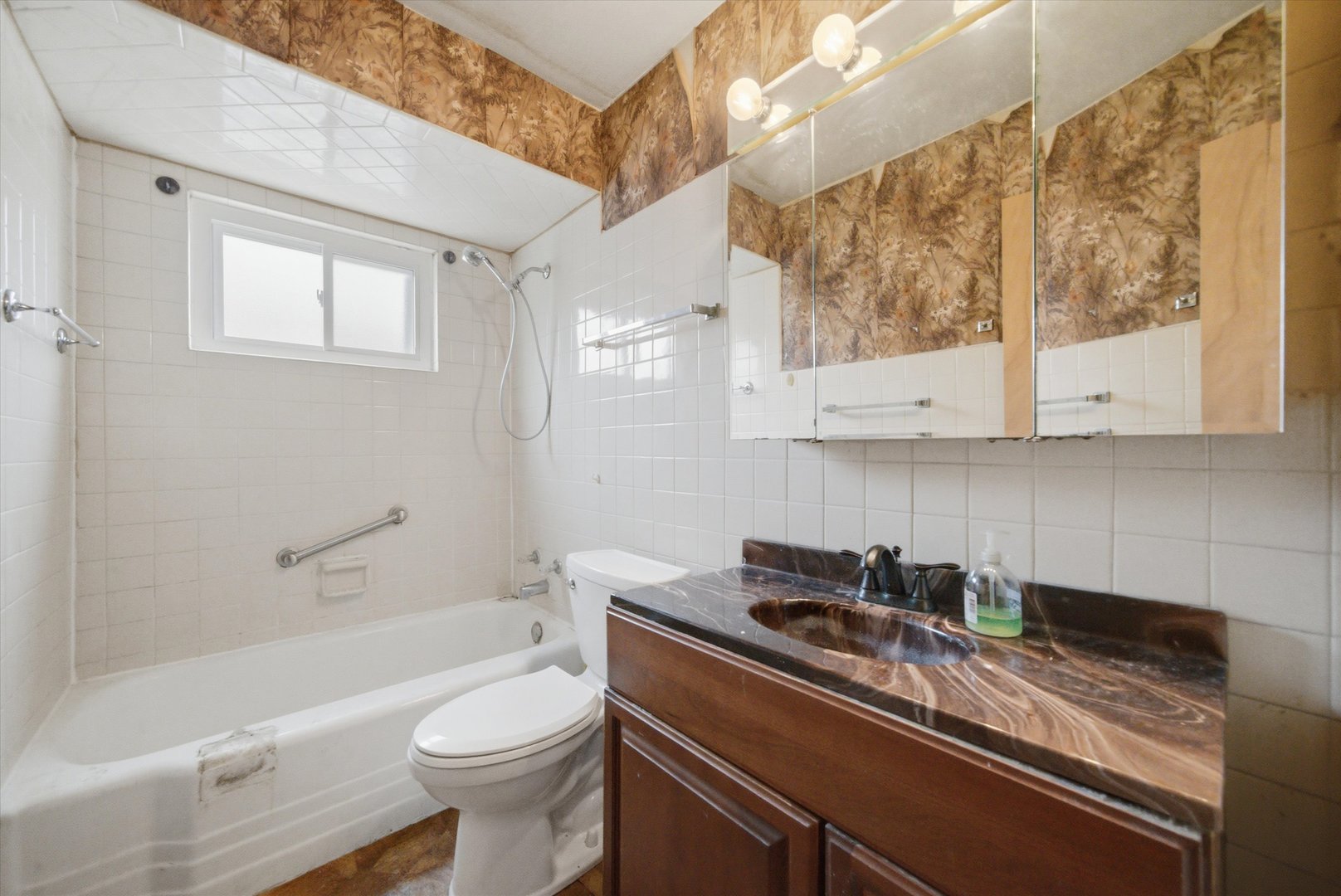 119 Rice Avenue Bellwood, IL 60104 - Photo 7 of 25 a bathroom with a sink a toilet and bathtub