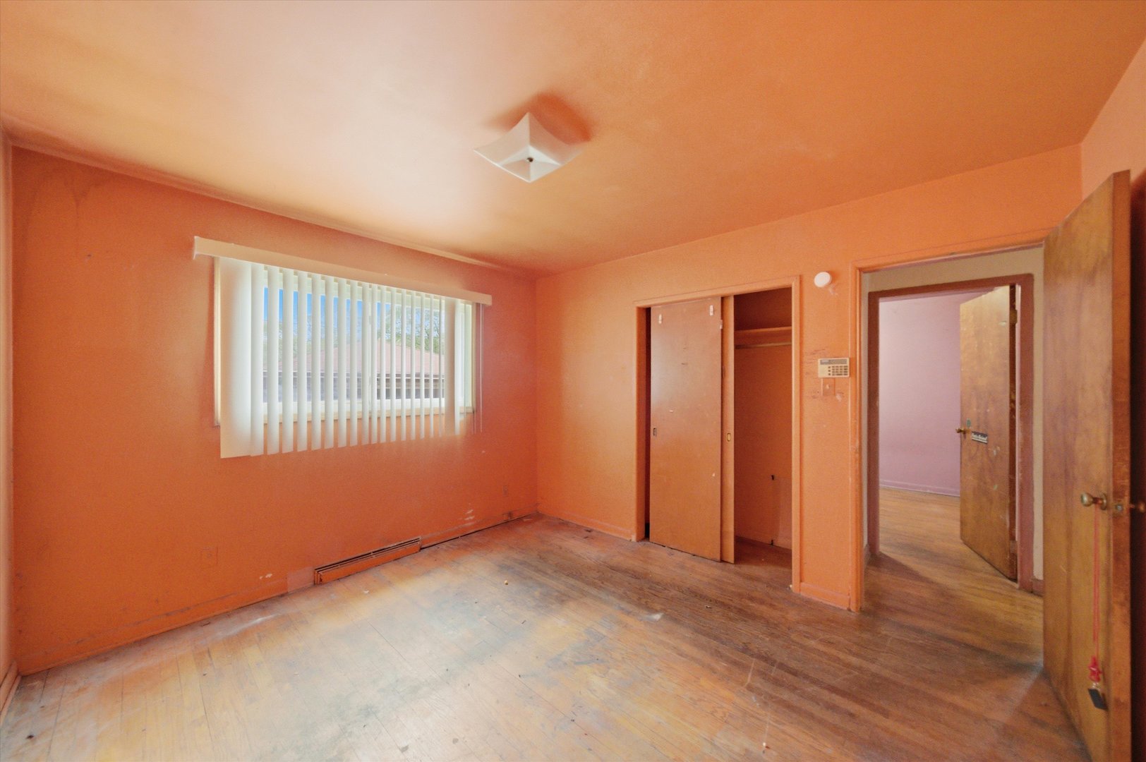 119 Rice Avenue Bellwood, IL 60104 - Photo 8 of 25 a view of an empty room with wooden floor and a window