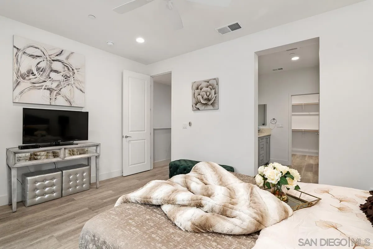 347 Oak Avenue Carlsbad, CA 92008 - Photo 11 of 34 a bedroom with a bed and a flat screen tv