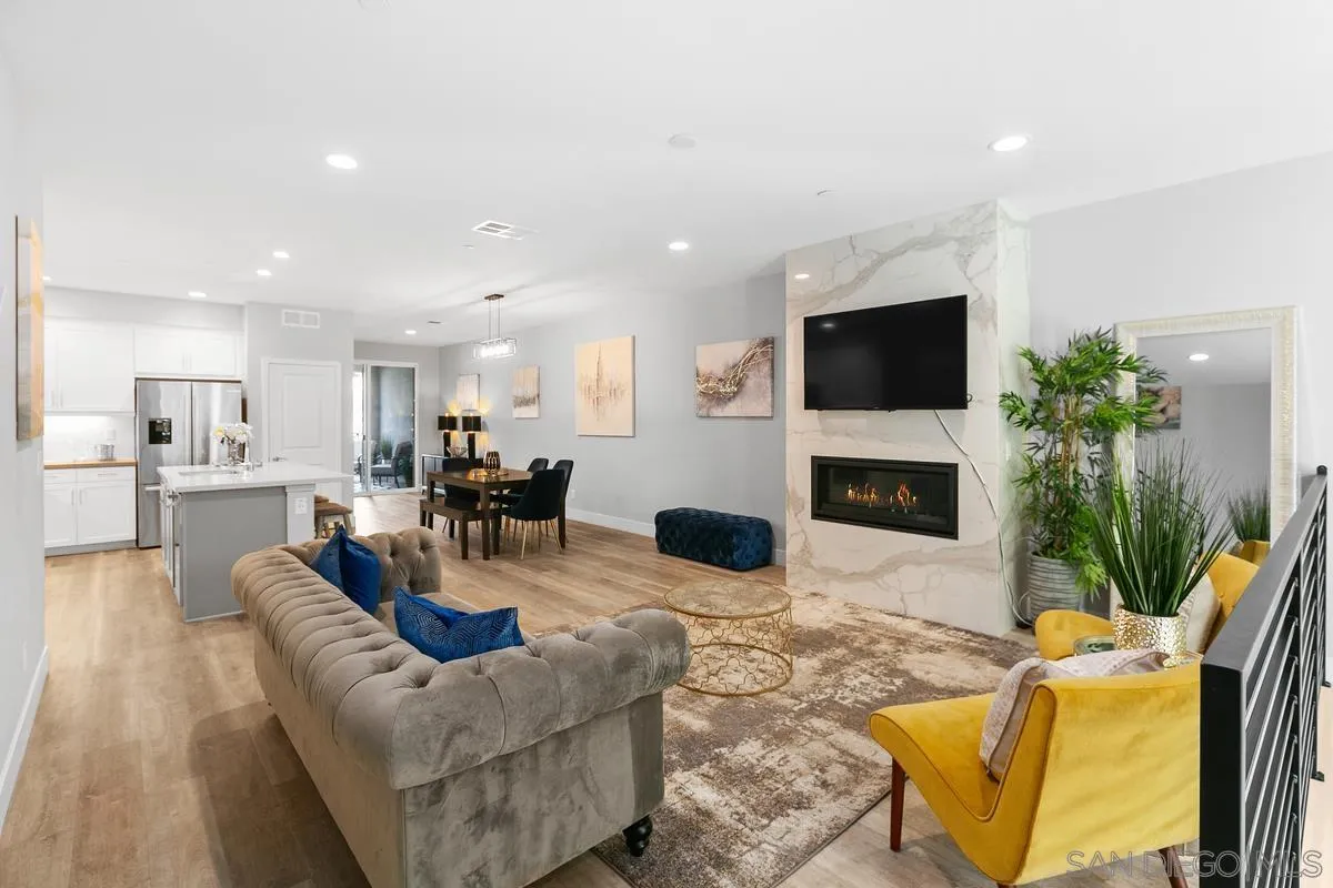 347 Oak Avenue Carlsbad, CA 92008 - Photo 13 of 34 a living room with furniture a fireplace and a flat screen tv