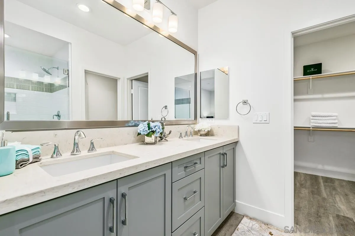 347 Oak Avenue Carlsbad, CA 92008 - Photo 22 of 34 a bathroom with a sink and a mirror