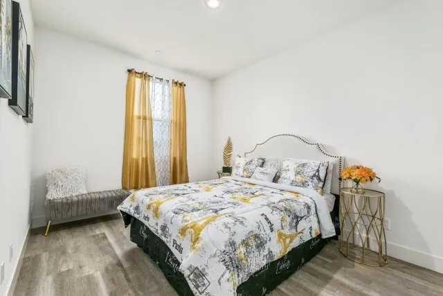 a bedroom with a bed and a window