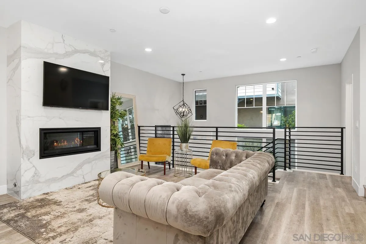 347 Oak Avenue Carlsbad, CA 92008 - Photo 32 of 34 a living room with furniture and a fireplace