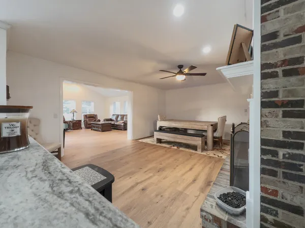 a view of a large trees with a house in the background