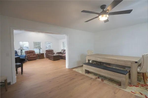 a view of a table and chairs in the garden