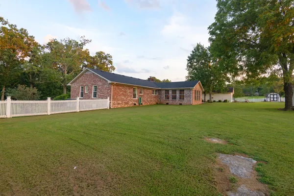 a large kitchen with a stove top oven