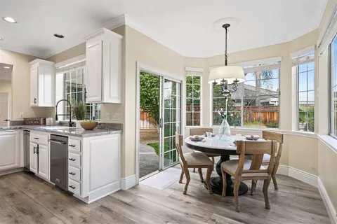 a view of a dining room with furniture window and outside view