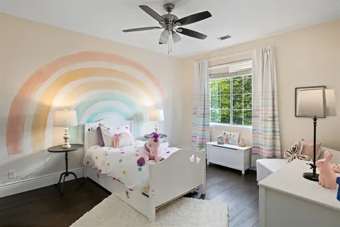 a bed room with a bed mirror and a window