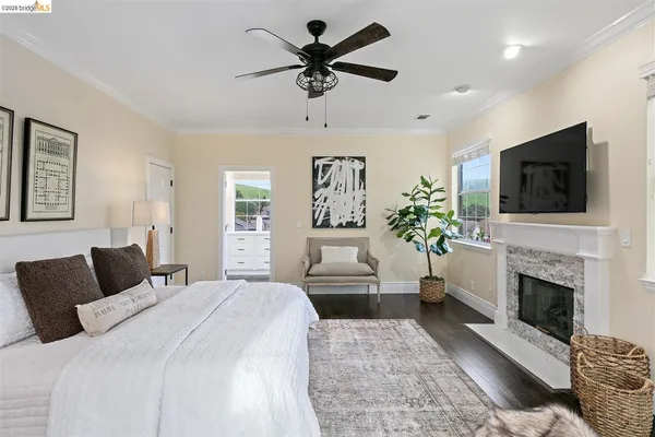 a bedroom with a bed and a fireplace