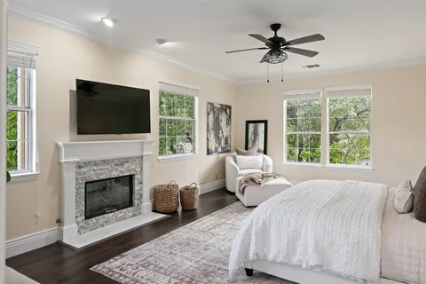 a bedroom with a bed and a fireplace