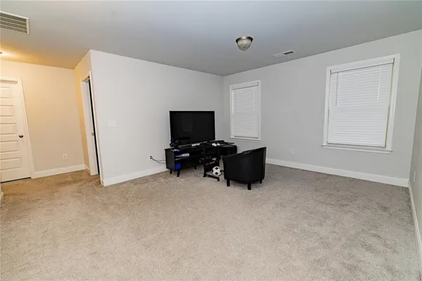 a room with furniture and a flat screen tv