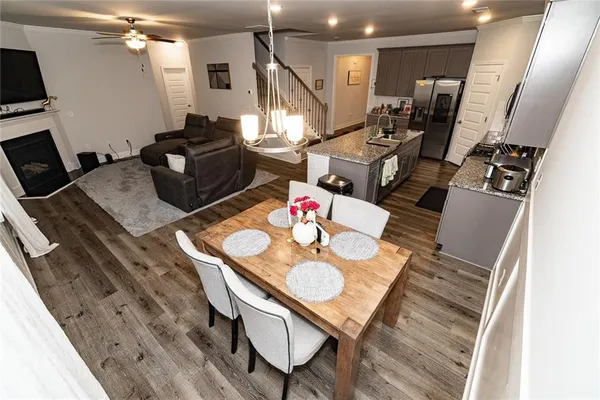 a view of a dining room with furniture and wooden floor