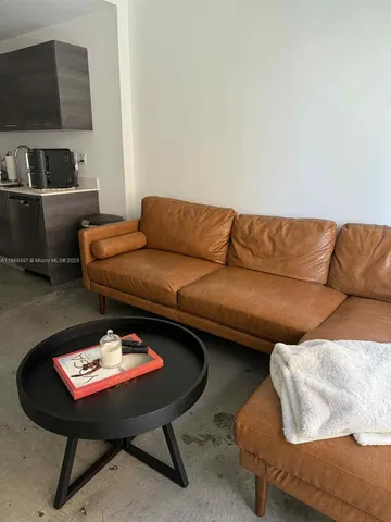 a living room with a couch and a flat screen tv
