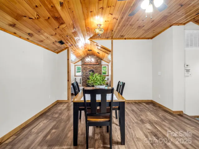 a dining room with furniture and window