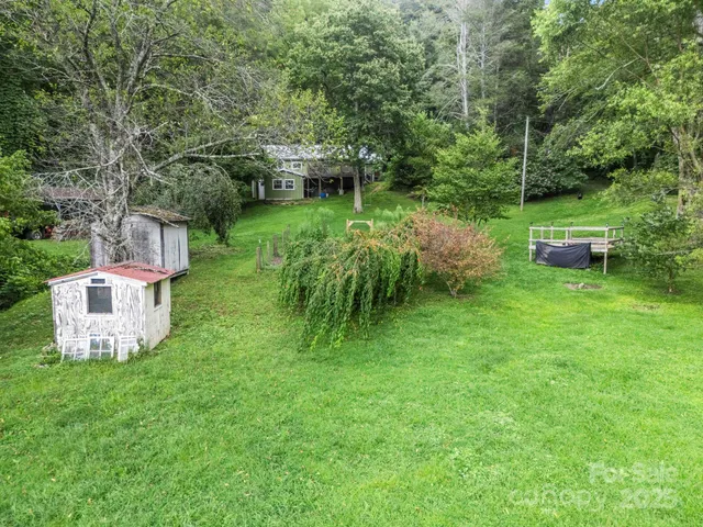 a backyard of a house with a wooden deck and floor
