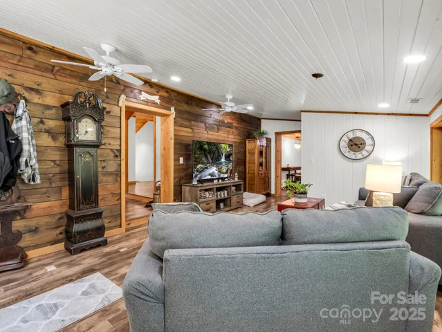 a living room with furniture and a clock
