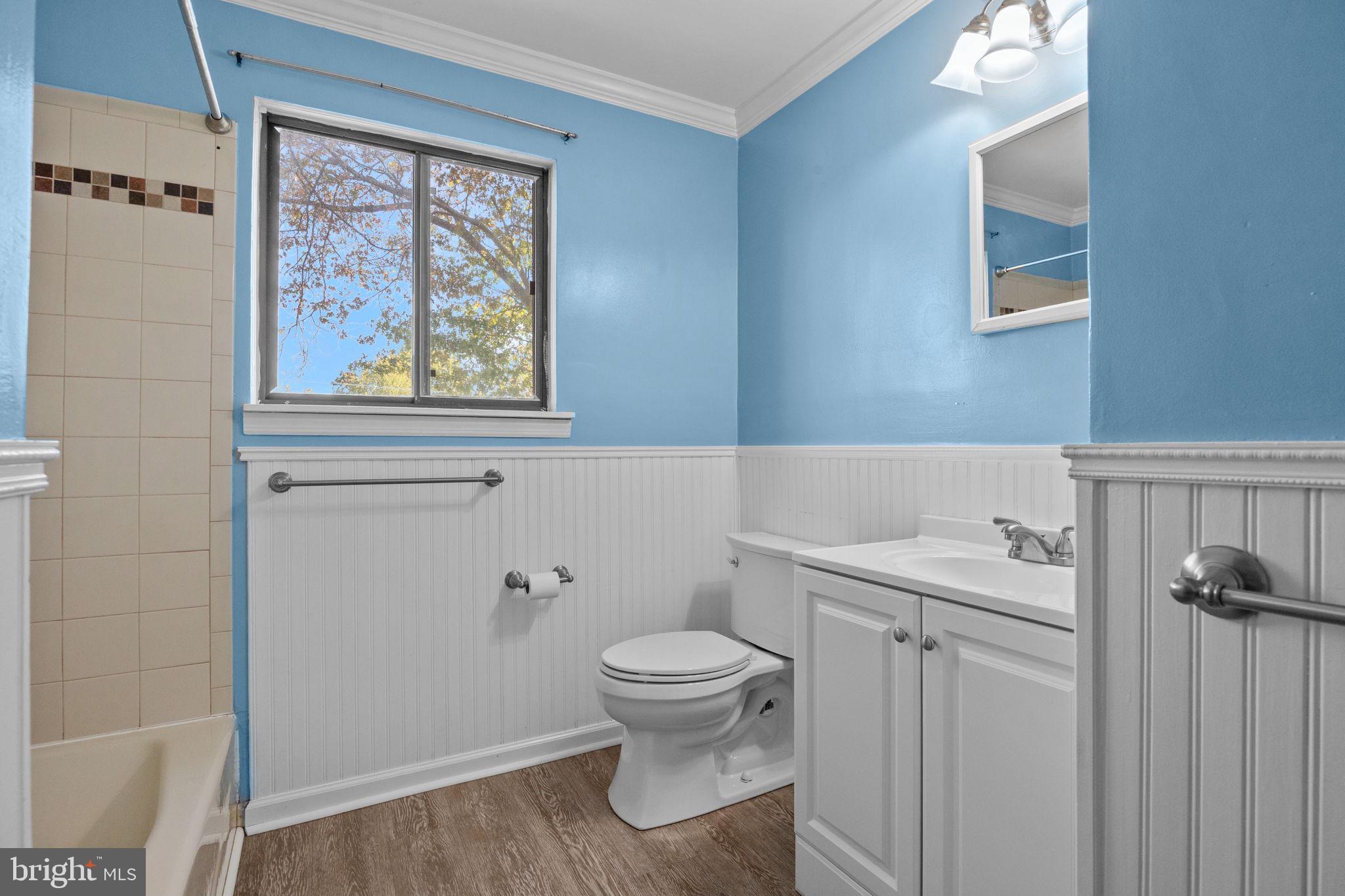 1006 North York Road, Unit 1 Willow Grove, PA 19090 - Photo 20 of 26 a bathroom with a toilet a sink and a window